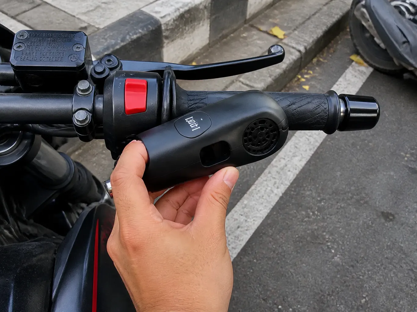 Close-up of the Ventra alarm speaker and lock cylinder