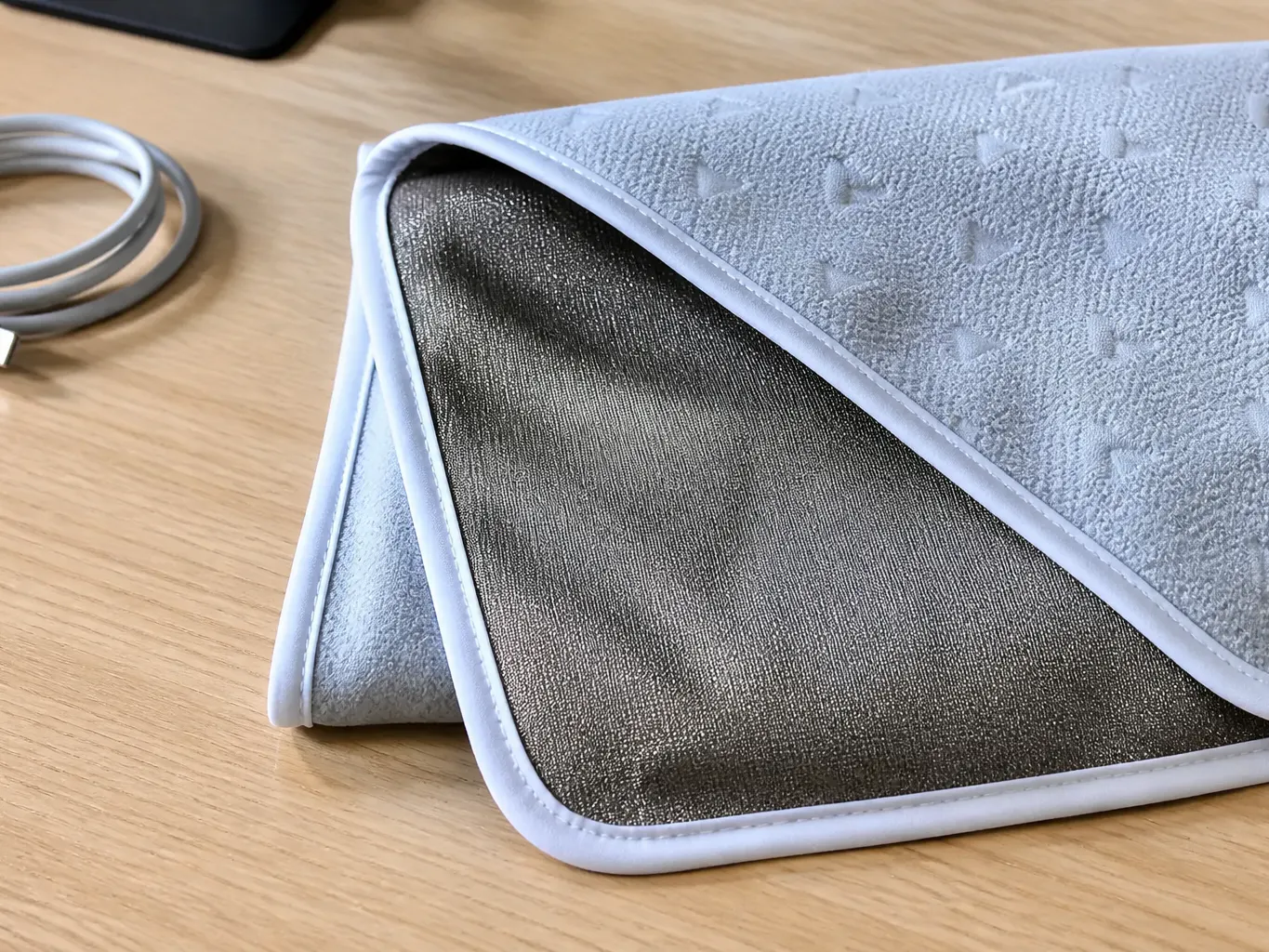 Annotated macro of the Ventra blanket showing the cotton face and silver conductive shielding backing