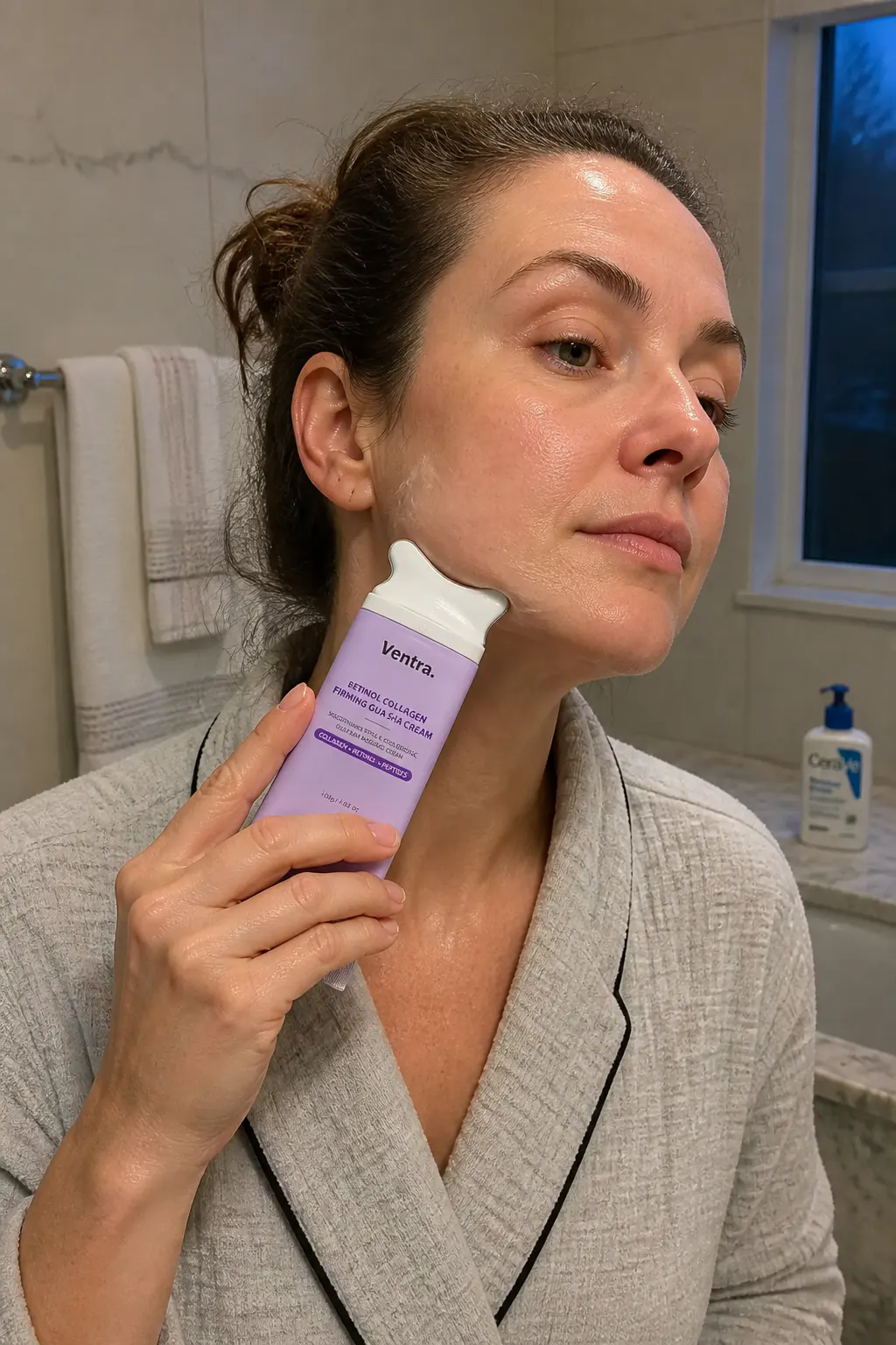 Ventra gua sha applicator gliding along the jawline