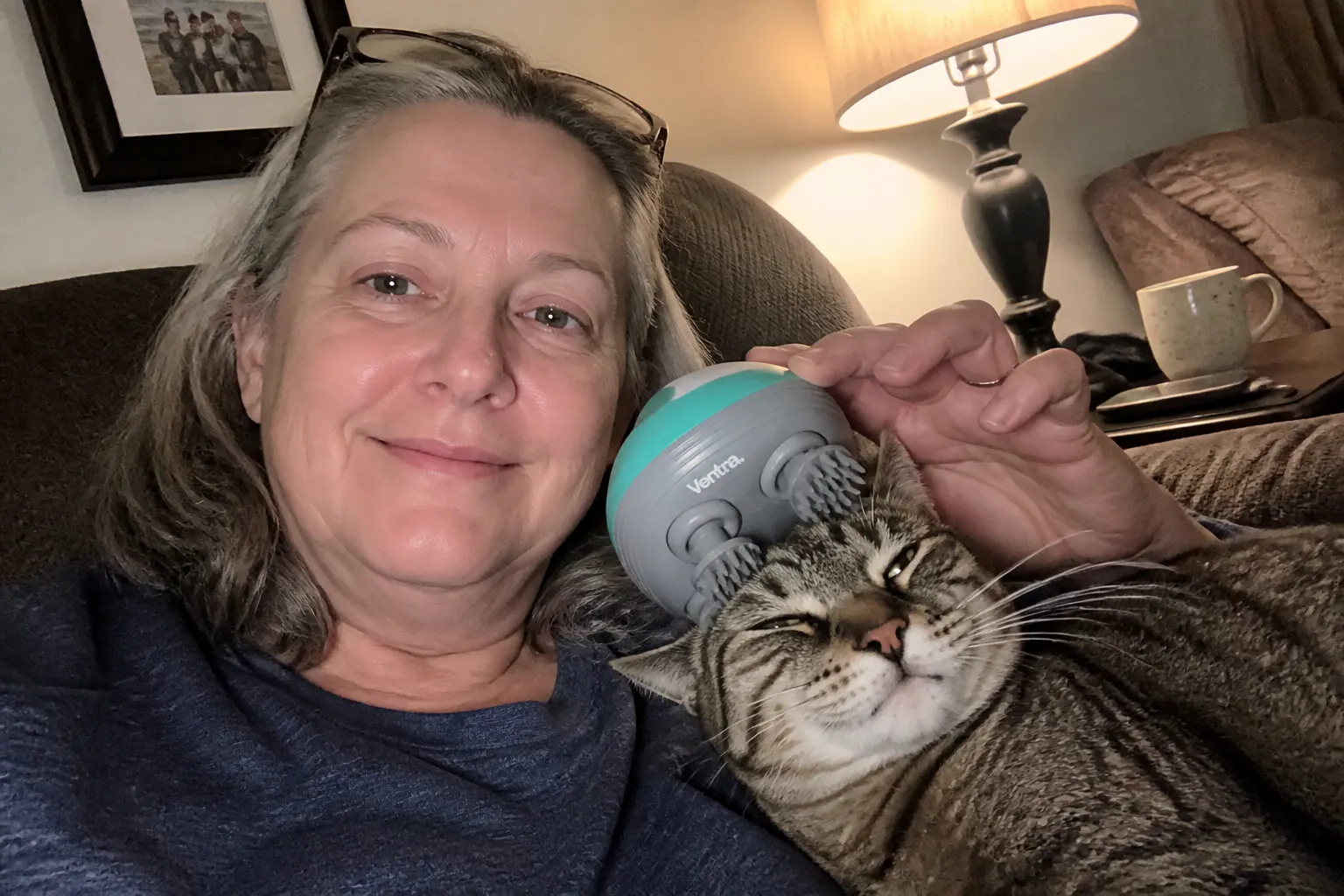 Cat using the massager