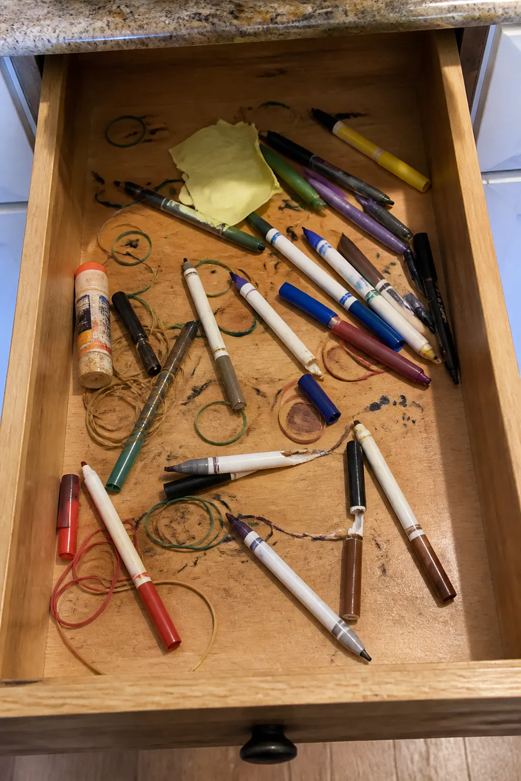 A cluttered drawer of dried-out, streaky, half-working paint pens