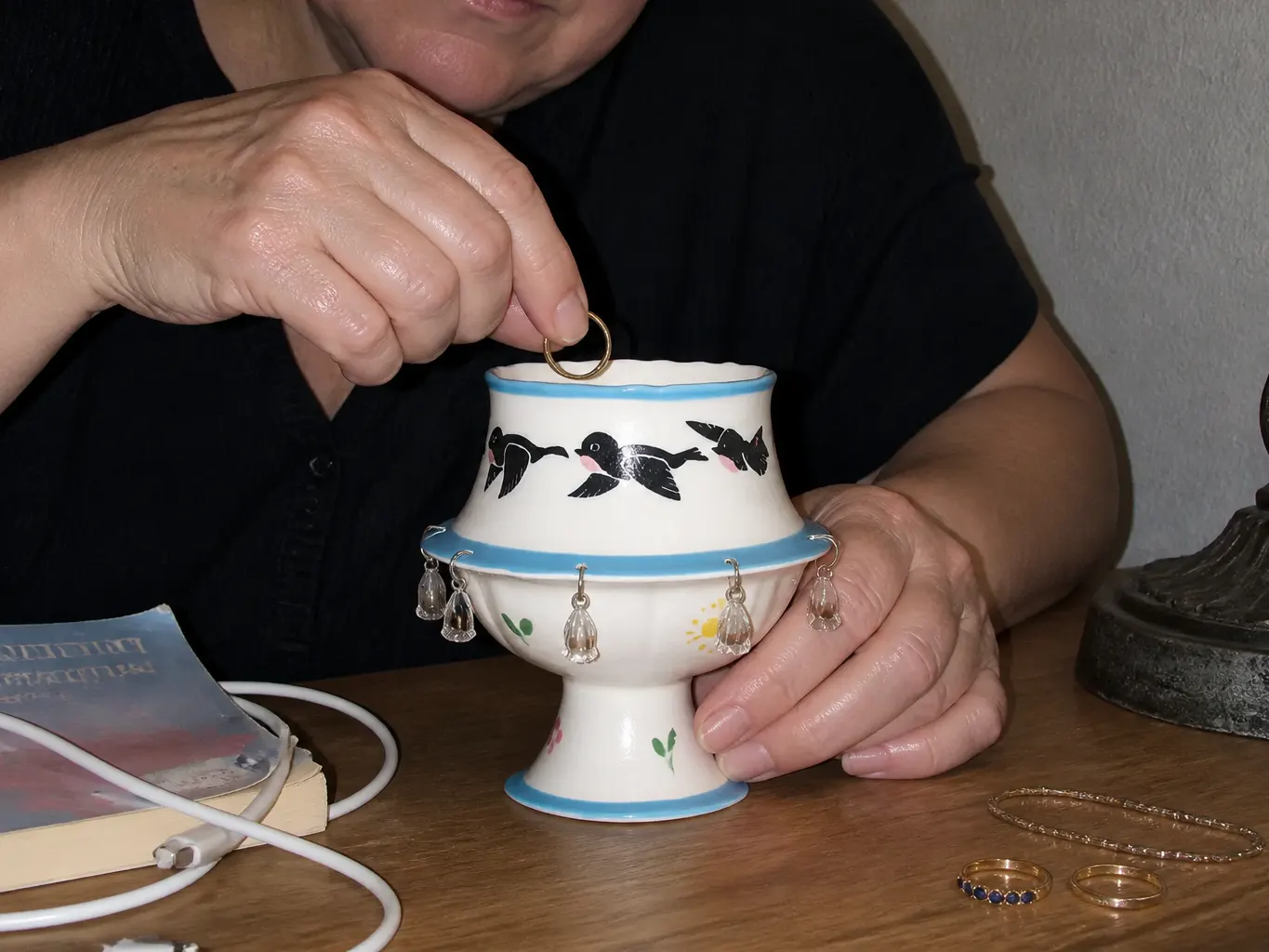 The cup on a spare console under lamplight