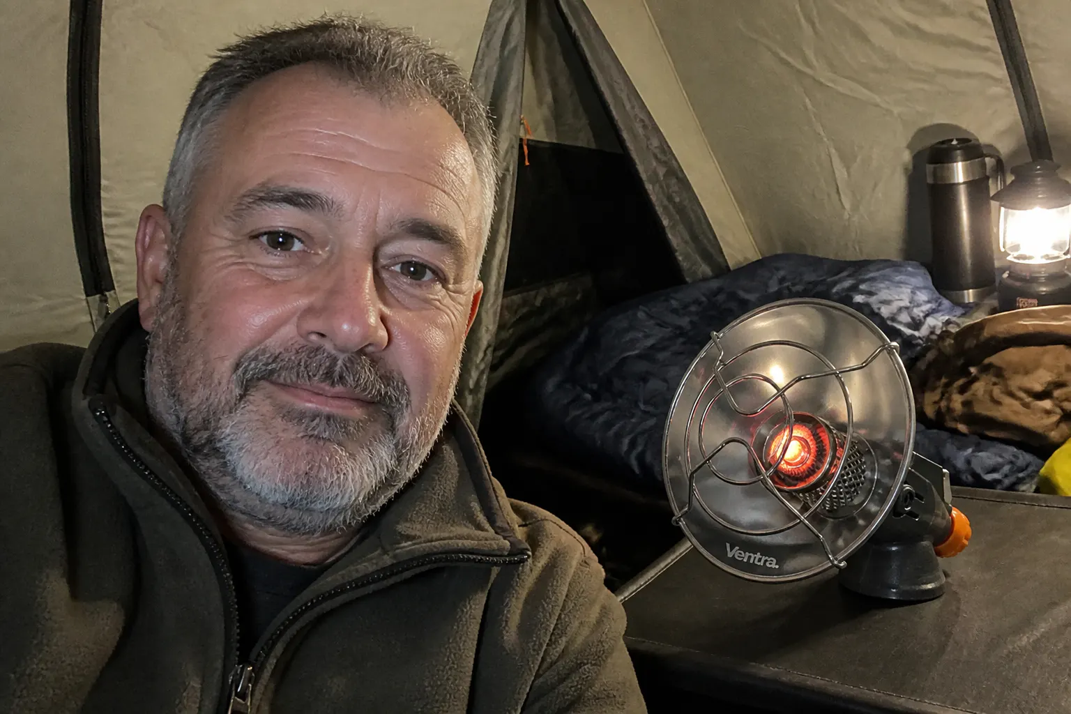 Ventra heater glowing at a winter campsite
