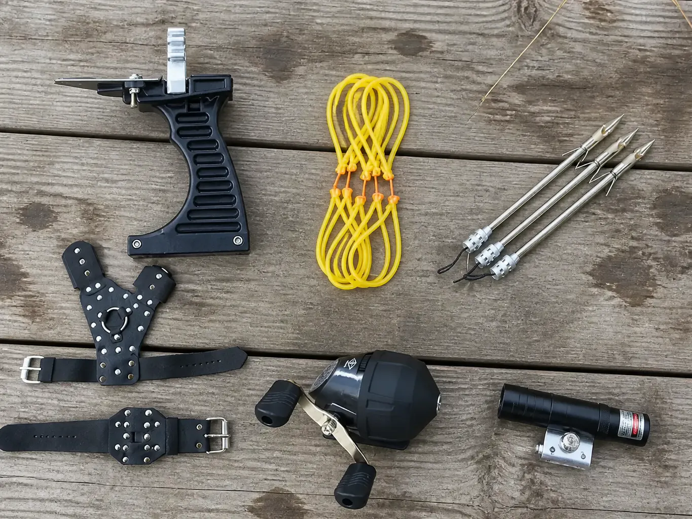 Overhead flat-lay of the complete Ventra slingbow kit on dark canvas
