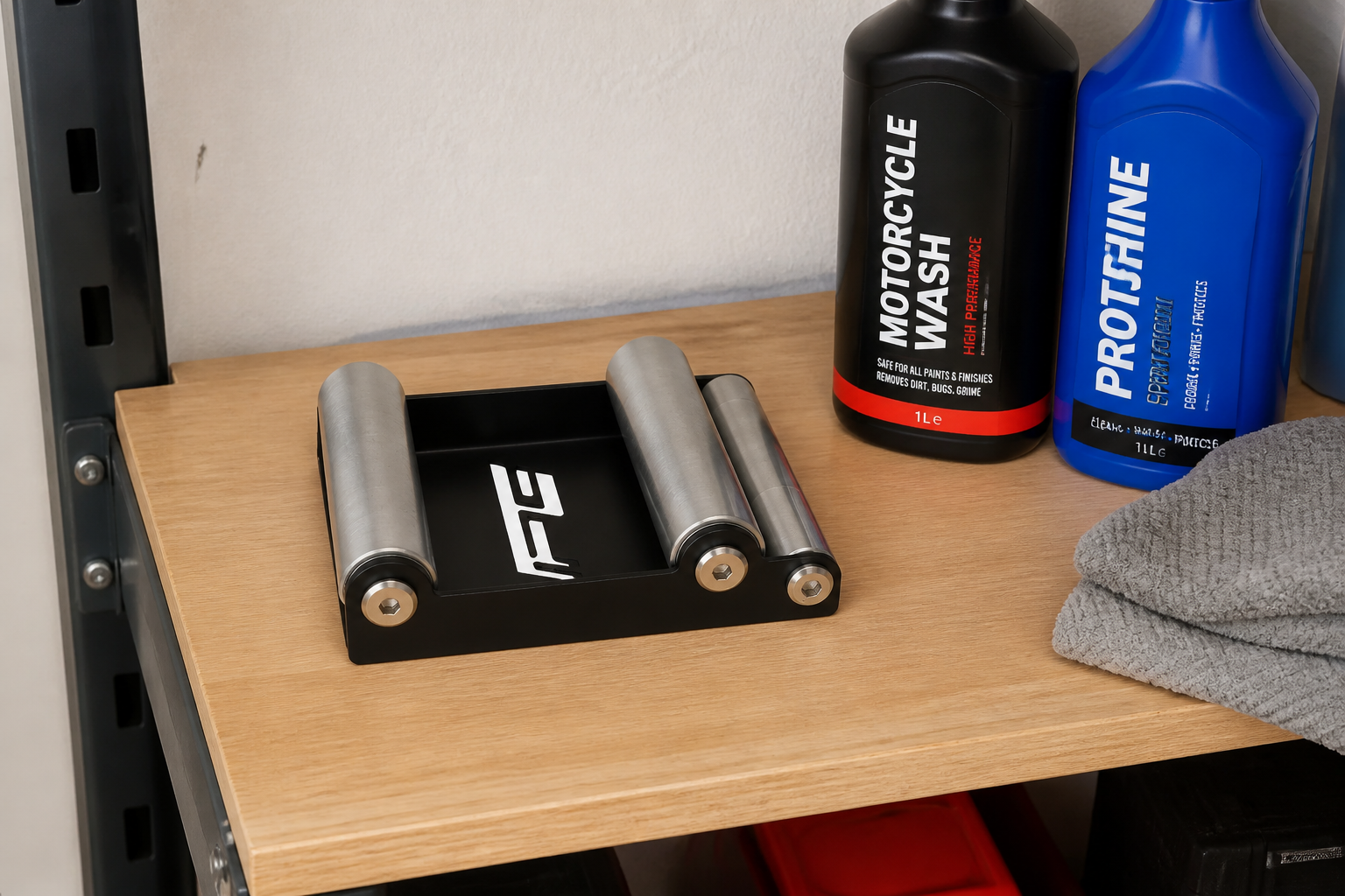 The bracket stored on a garage shelf showing its compact footprint
