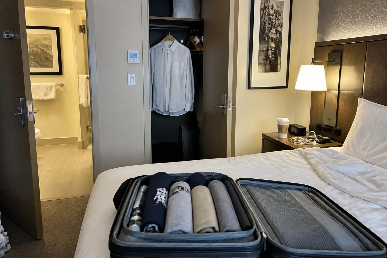 Compact bottle in a packing cube in a hotel room
