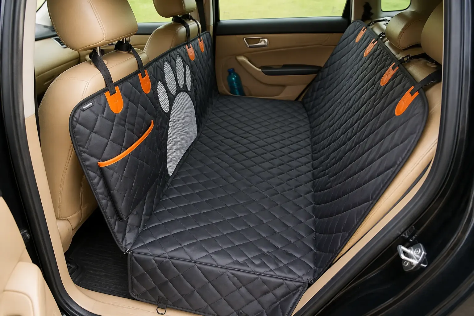 Hammock design bridging the footwell so the dog cannot fall forward