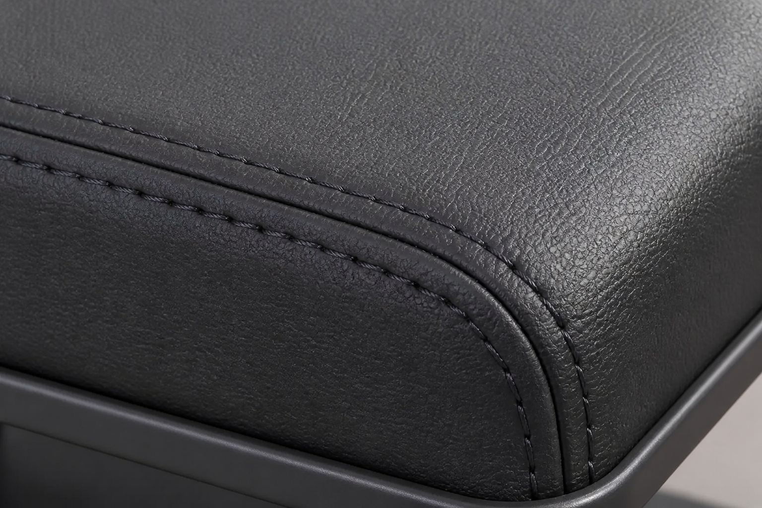 Stitched leather surface of the Ventra armrest