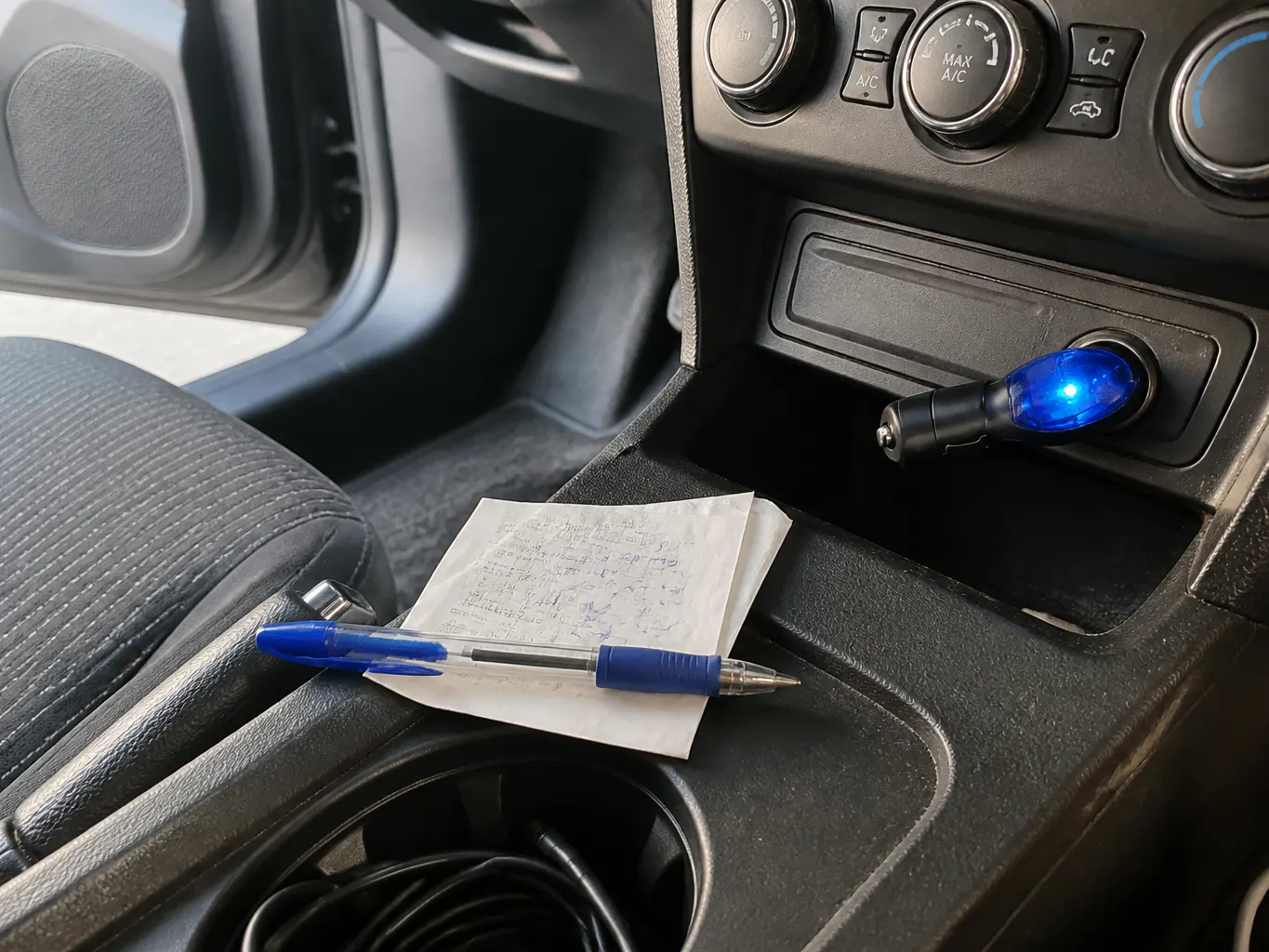 Handwritten fuel log next to an odometer reading