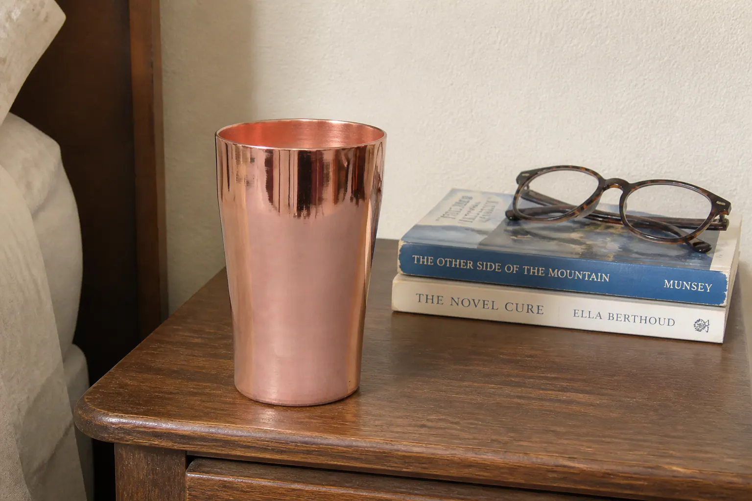 Macro close-up of solid copper cup wall showing warm unlined metal