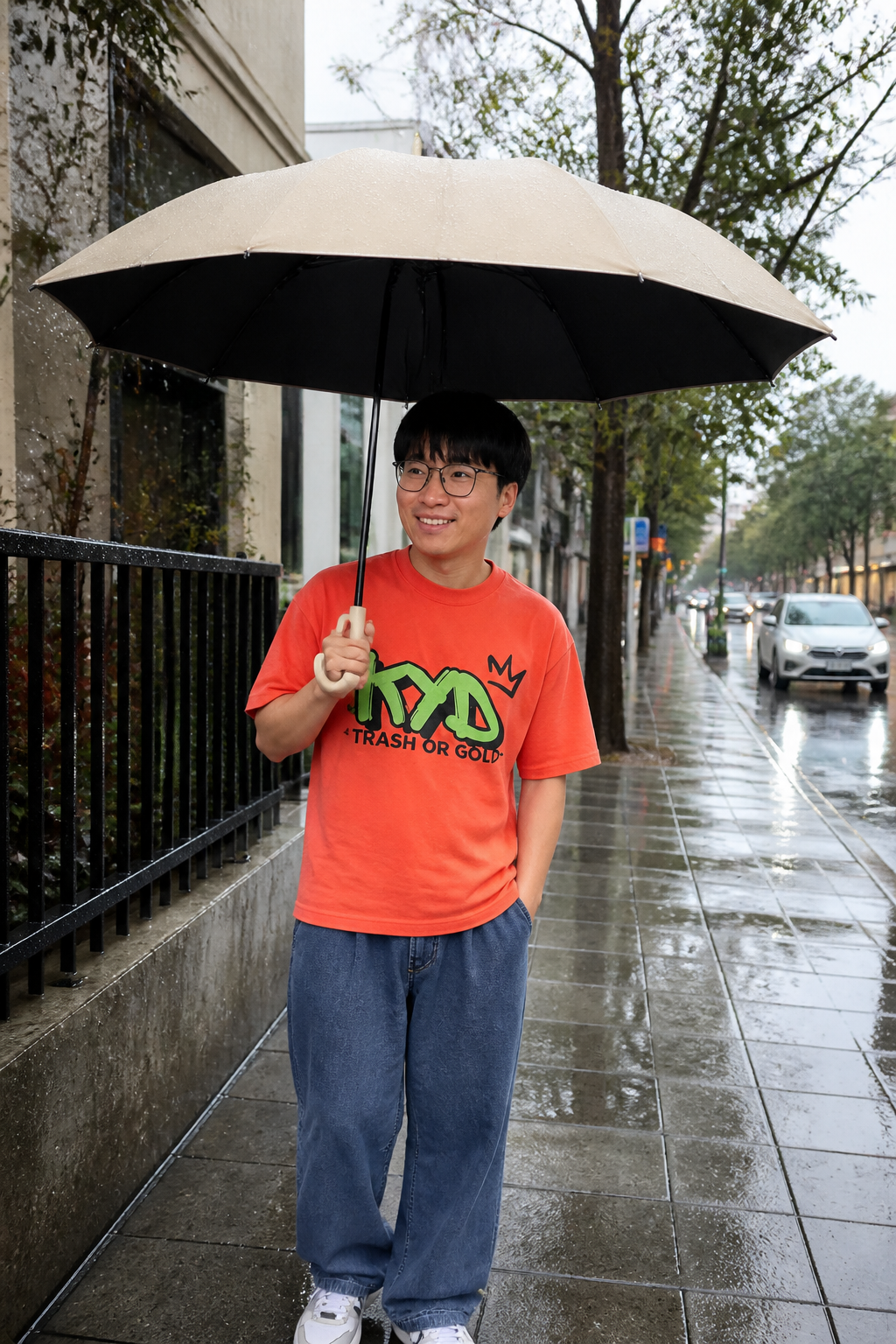Commuter staying dry in the rain with the reverse-fold umbrella