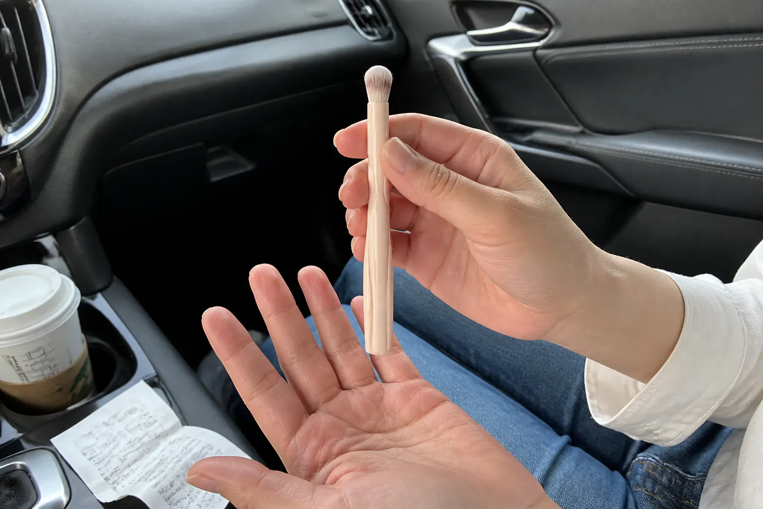 Concealer brush dabbing under the eye