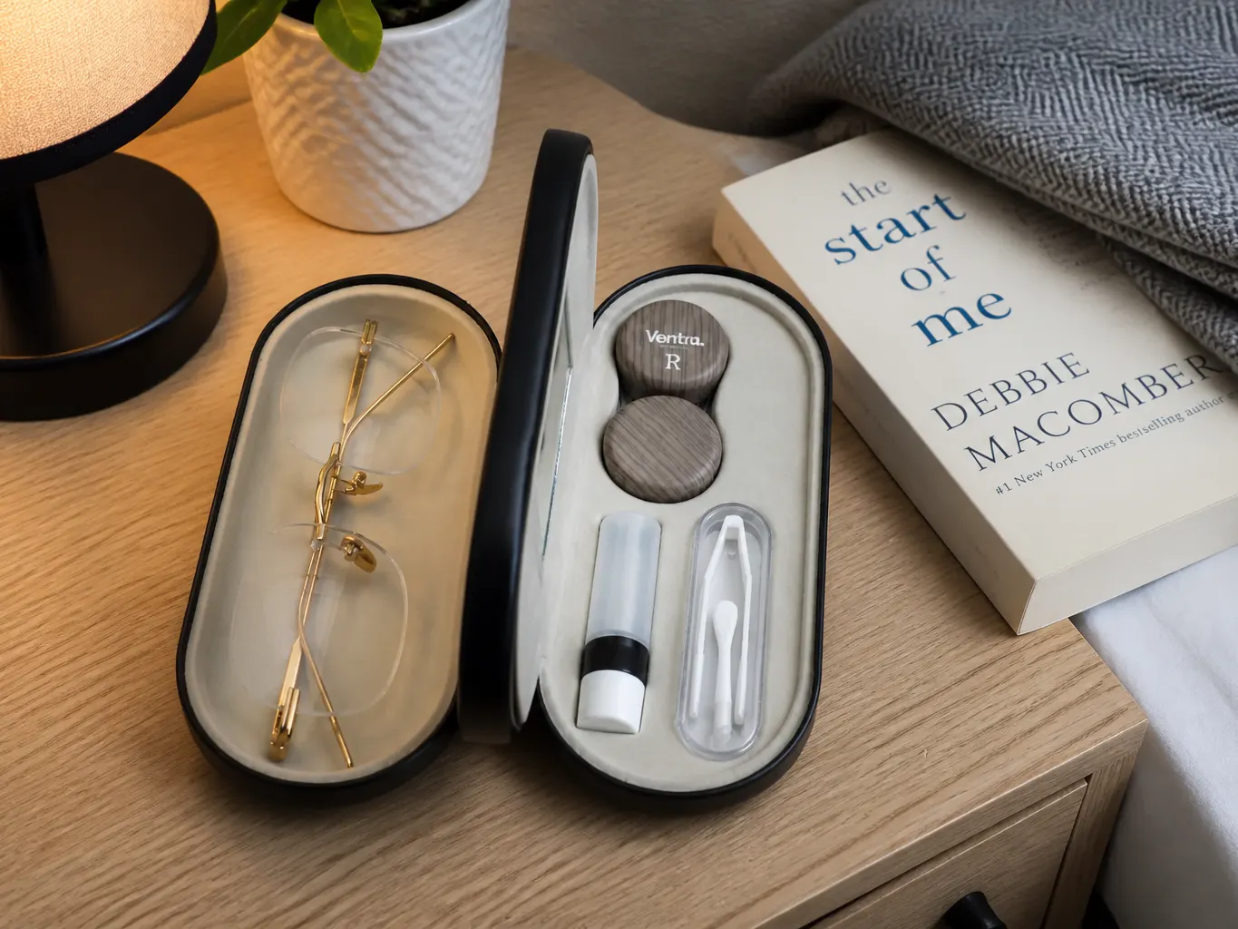DuoCase open showing glasses and contact station