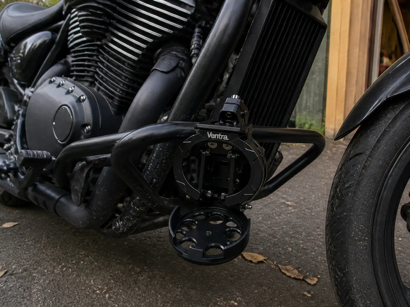 Holder clamped to a crash bar on a cruiser