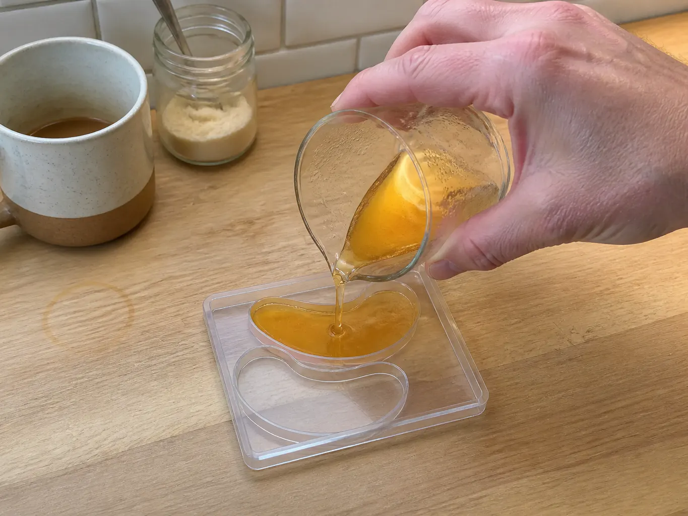 Warm gel being poured into the two crescent cavities