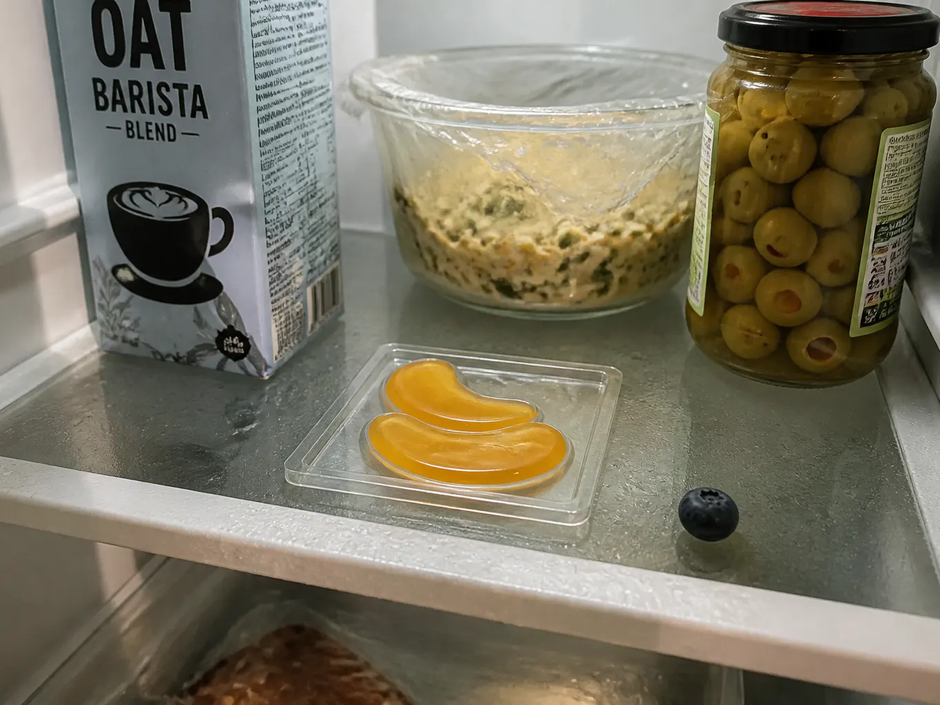 The filled tray sitting flat on a fridge shelf