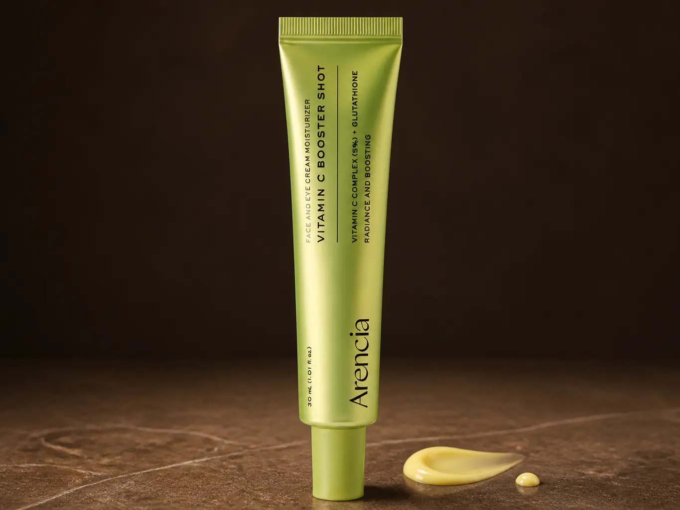 Vitamin C booster tube with golden cream visible