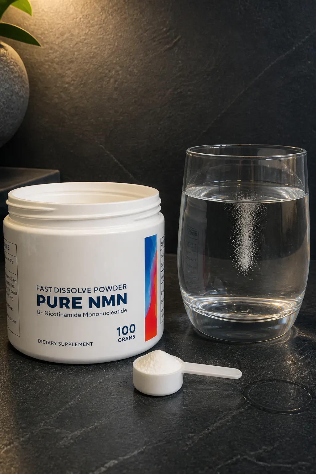 Ventra pure NMN powder dissolving clear in a glass of water beside the white tub