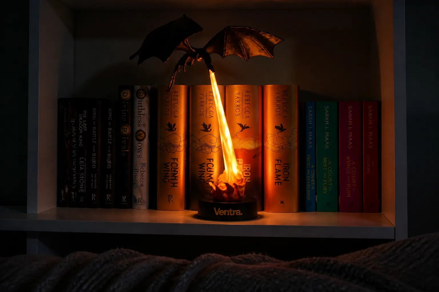 The USB-C lit flame glowing over book spines in a dark room