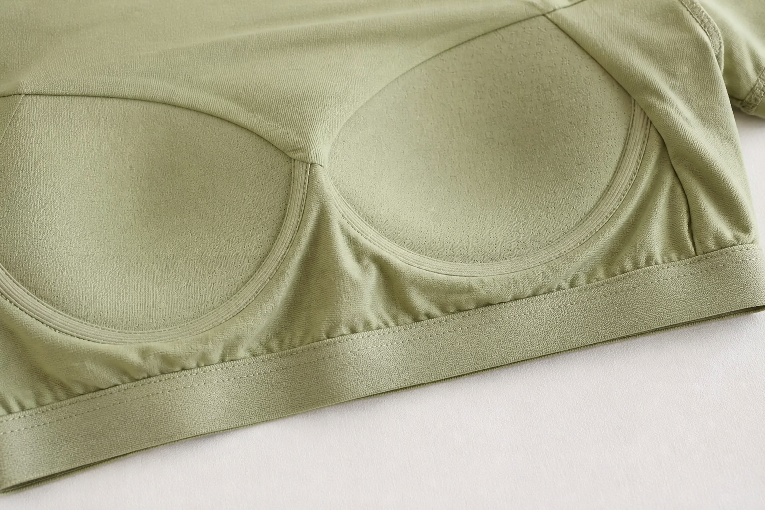 Close-up of the molded push-up cups sewn into the tee