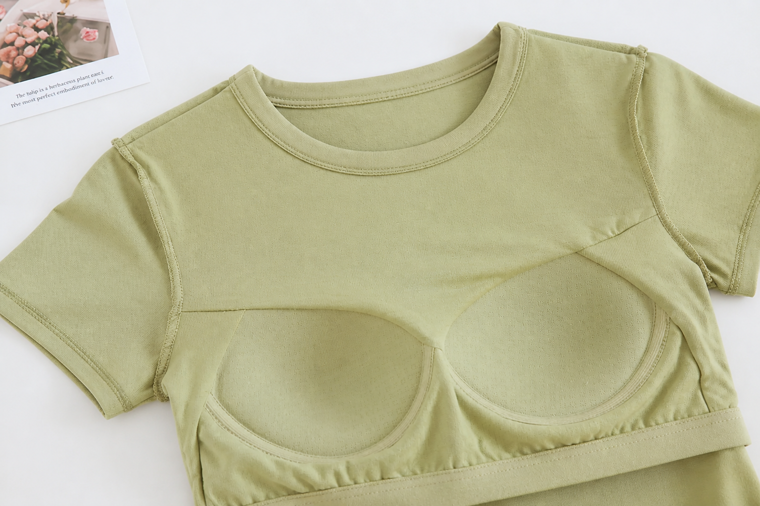 Close-up of the molded push-up cups sewn into the tee