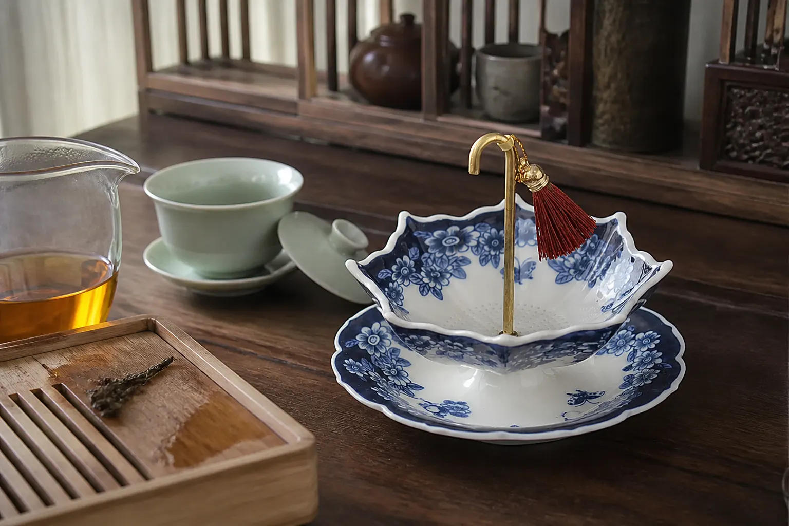 A considered tea corner with the porcelain umbrella strainer at its center