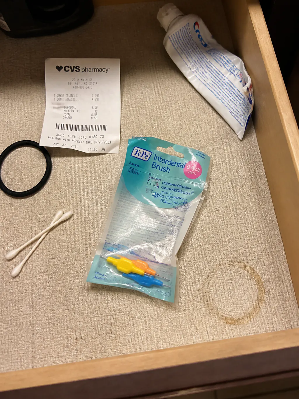 A near-empty pack of interdental brushes forgotten in a bathroom drawer