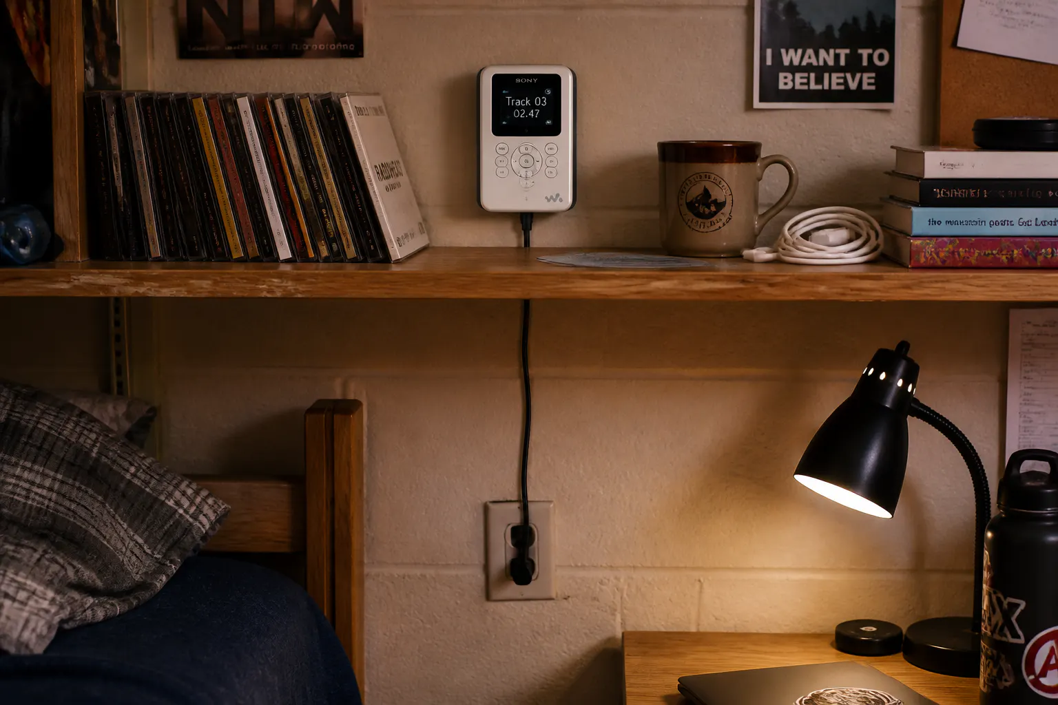 A CD player tethered to a wall outlet by a cord