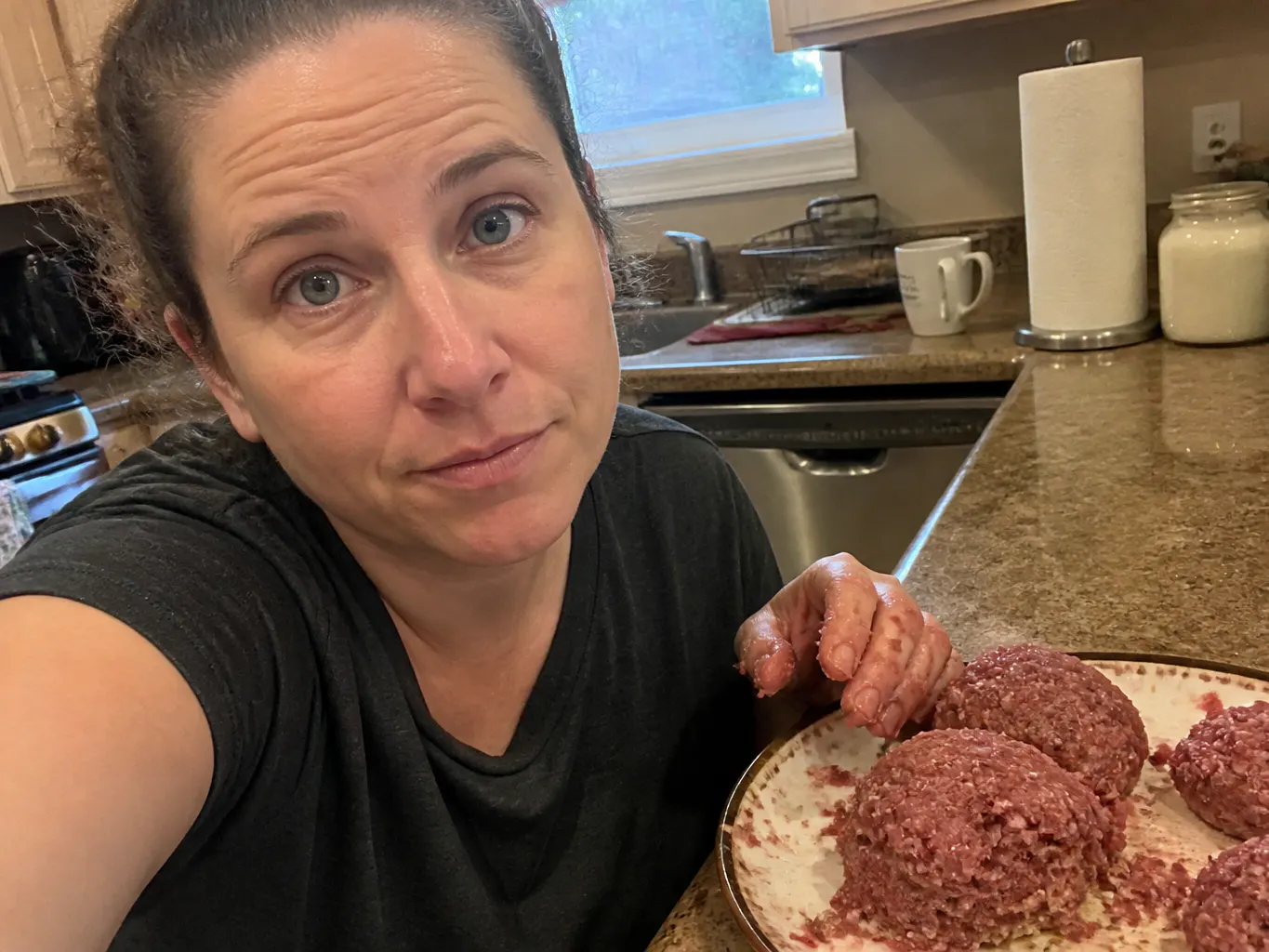 Lumpy uneven hand-rolled patties and a shapeless frozen meat lump in a bag