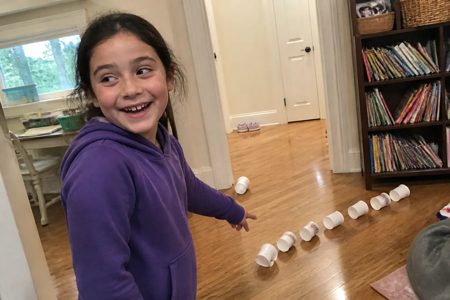 The assembled cannon firing an air ring that topples a stack of cups