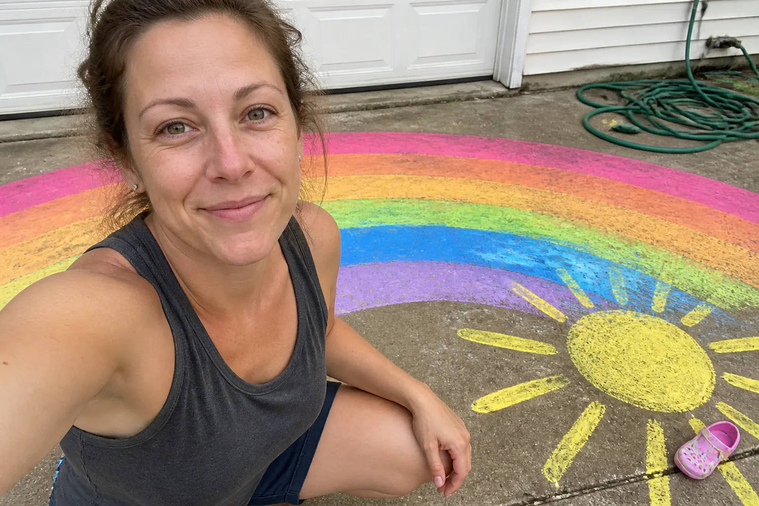 Vibrant colorful chalk paint artwork covering a driveway