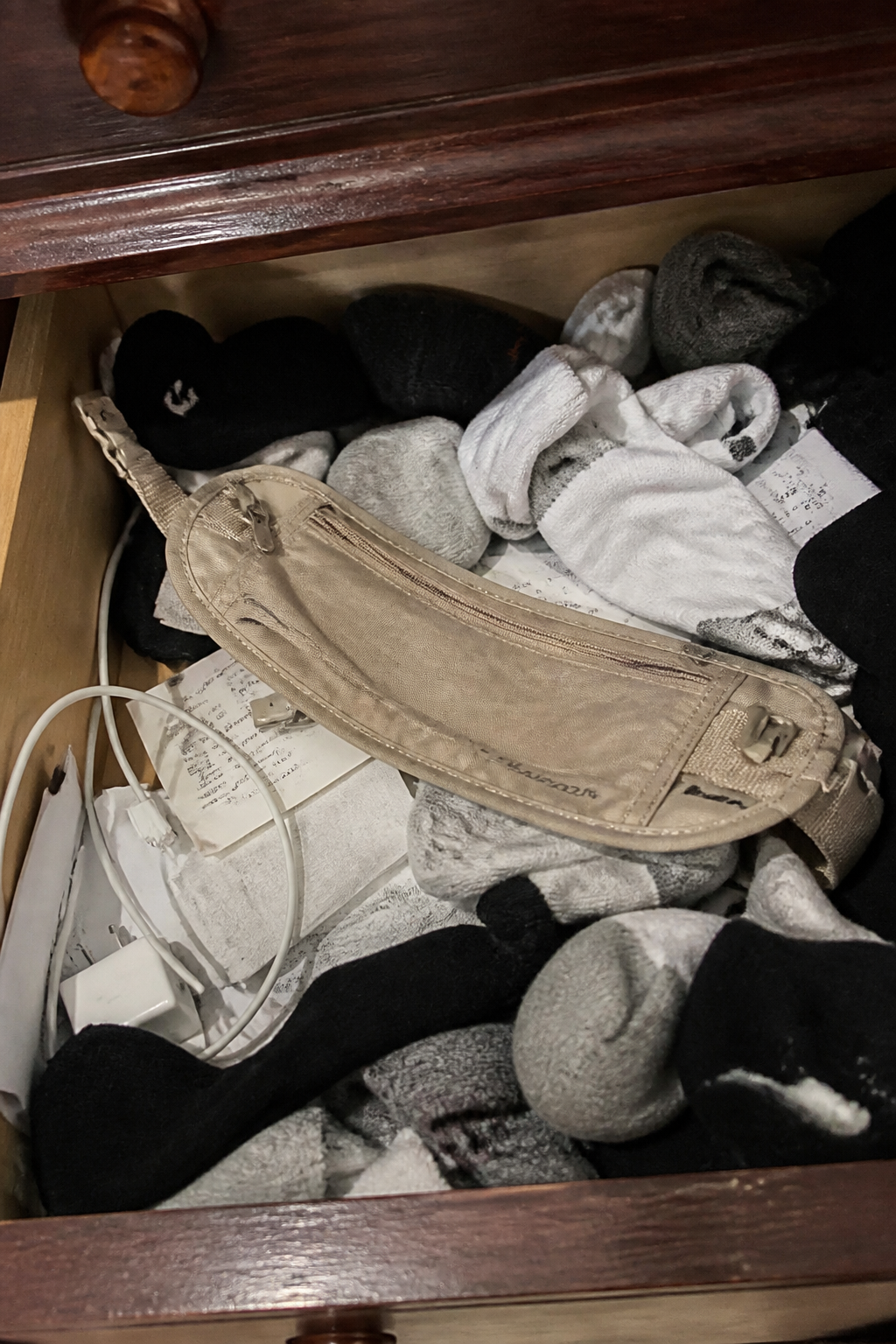 Crumpled money belt abandoned in a suitcase