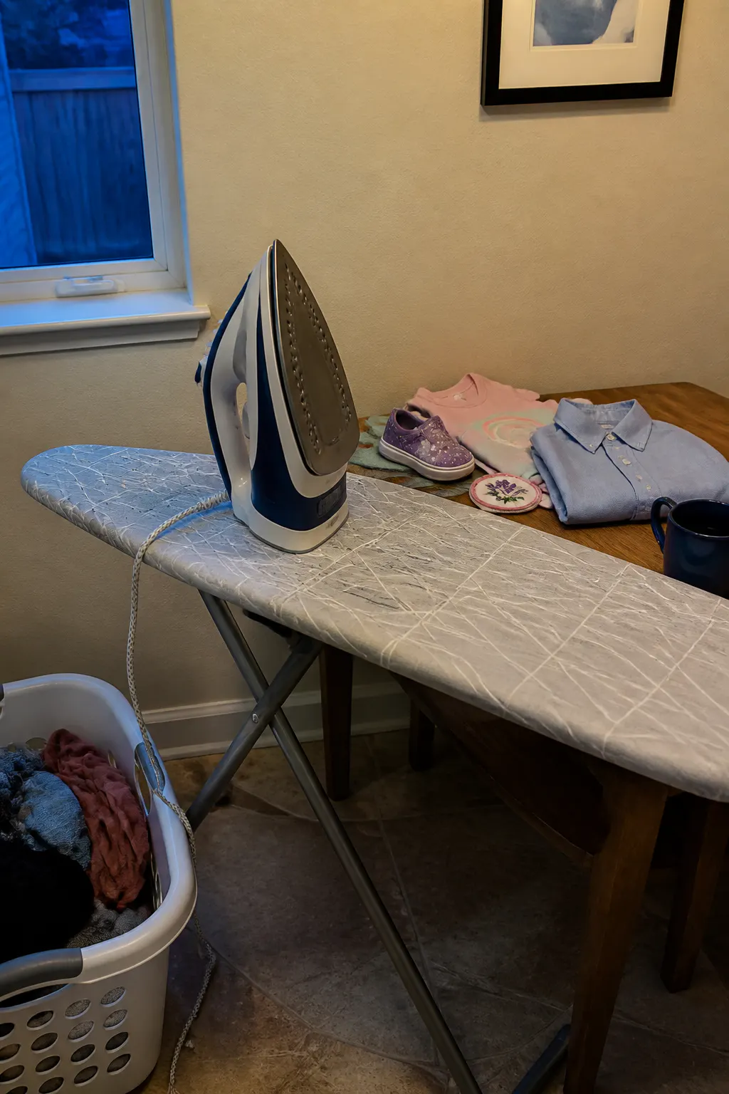 A heavy full-size iron and ironing board dragged out for a single small task