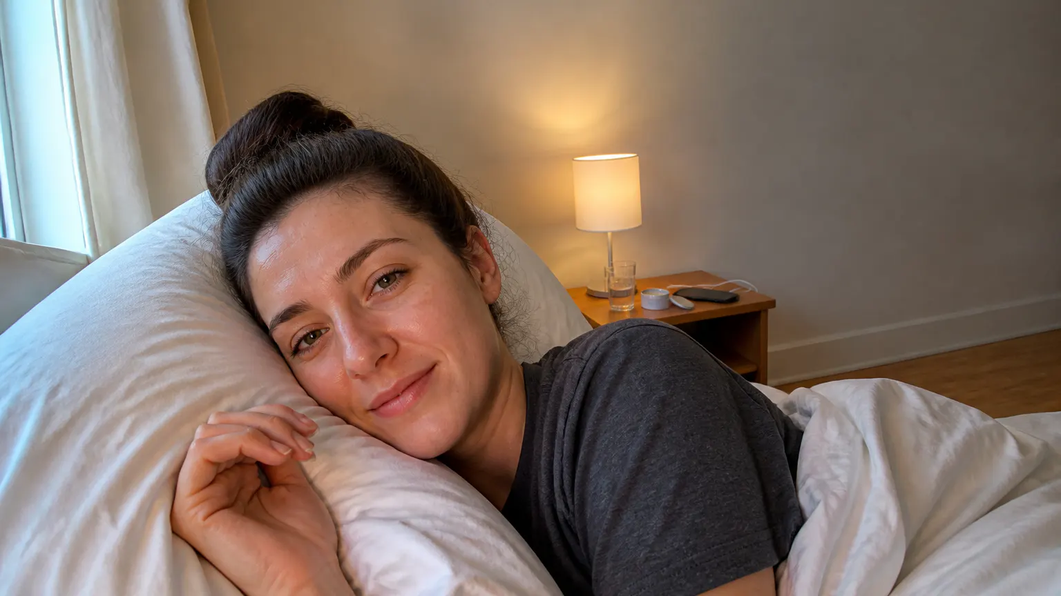 Morning light on the bed, the bonnet still seated on her head