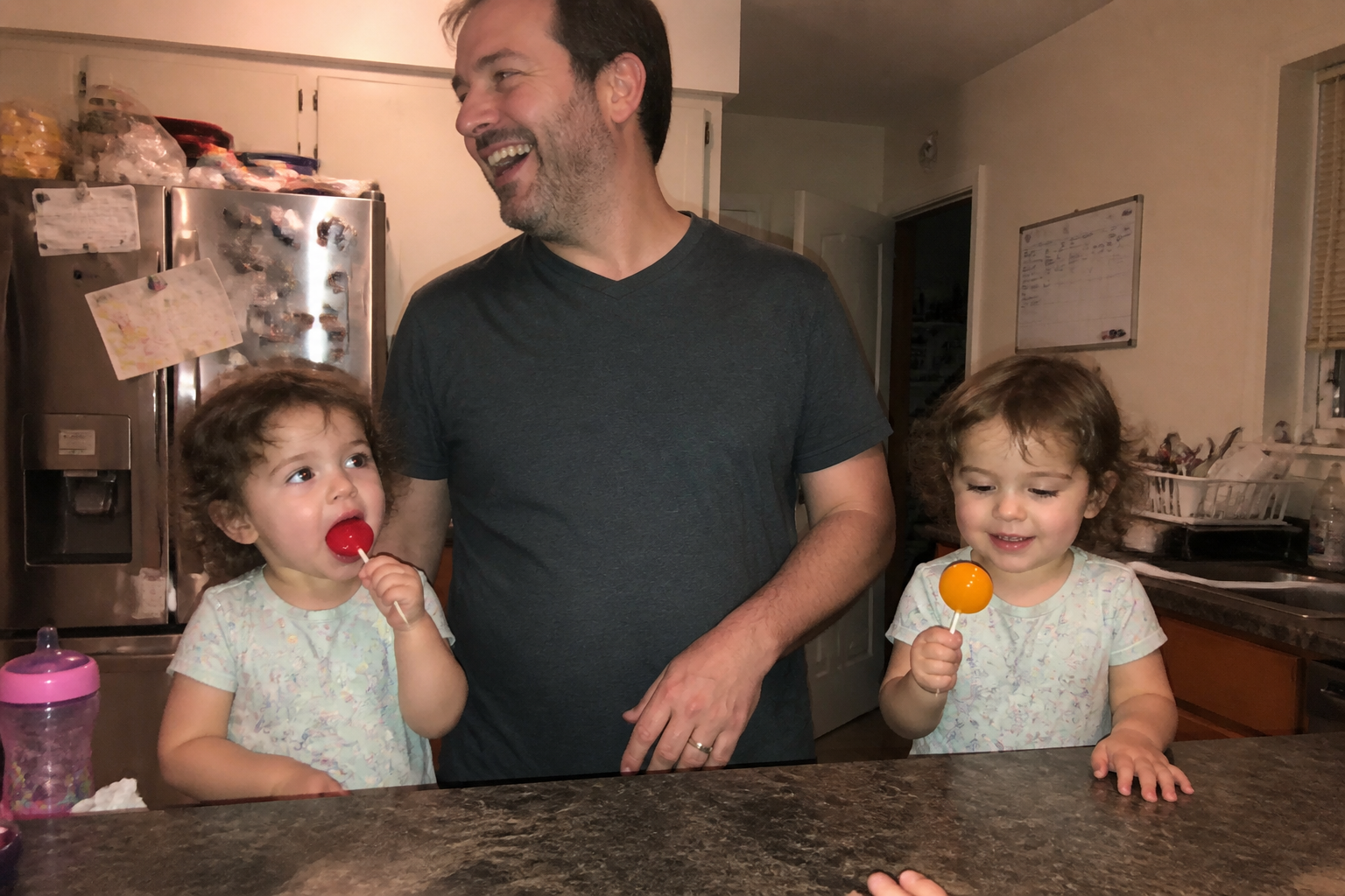 A child enjoying a homemade planet popsicle