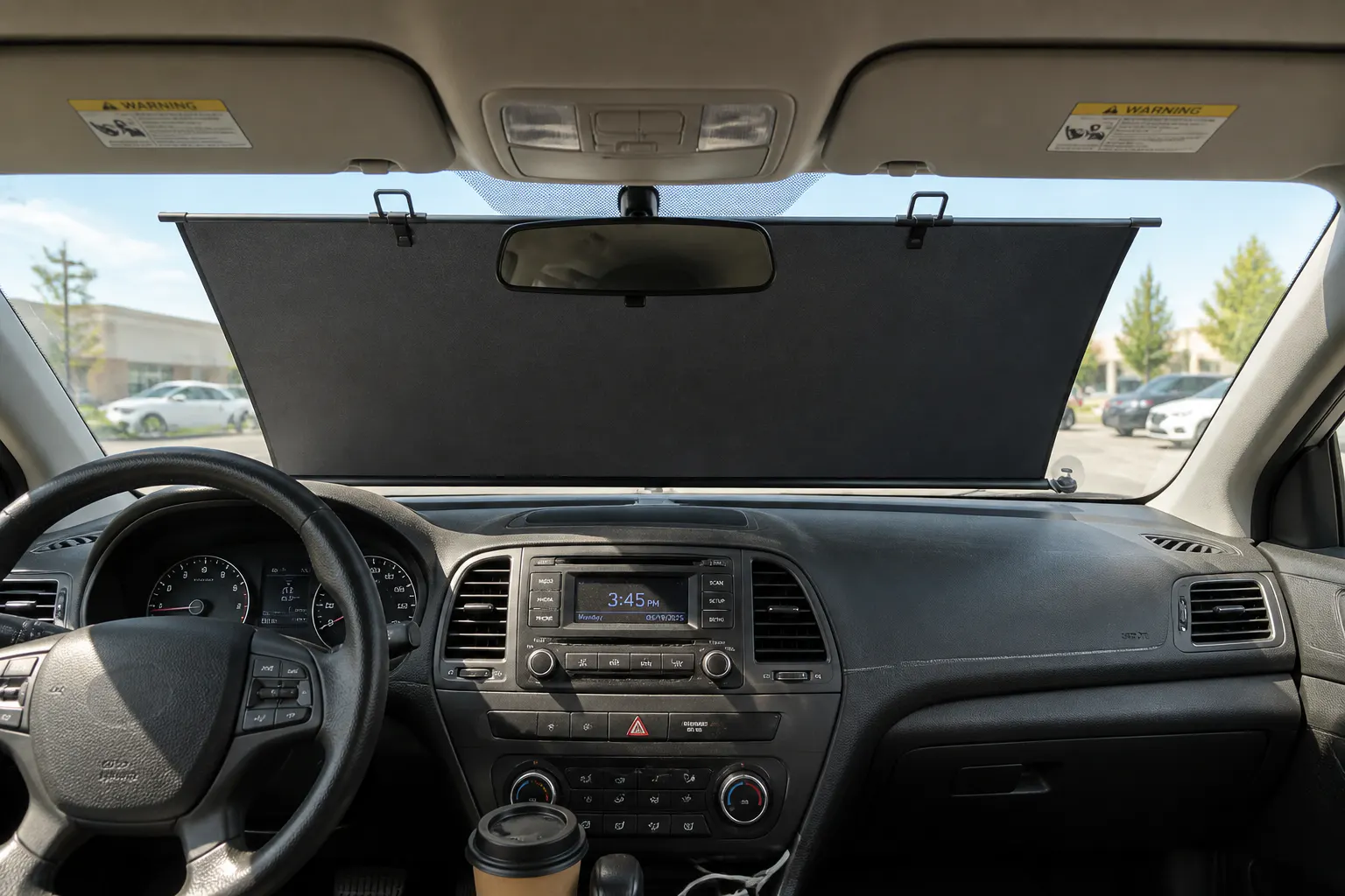 Ventra sunshade deployed on a windshield with the pre-cut mirror notch