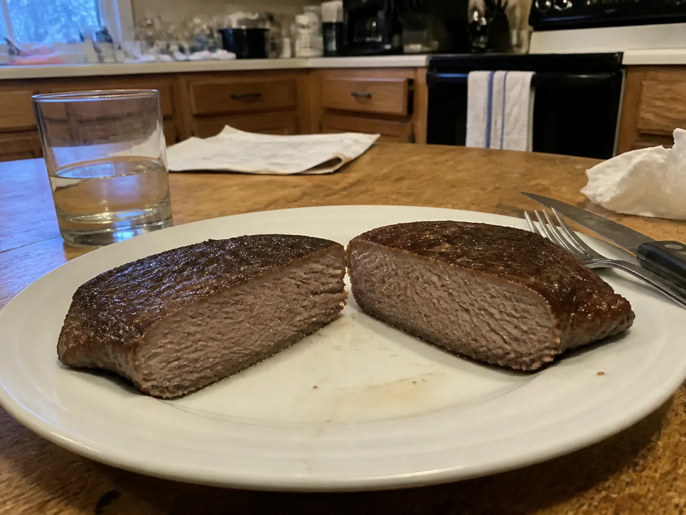 Untreated steak sliced open showing pale dry interior