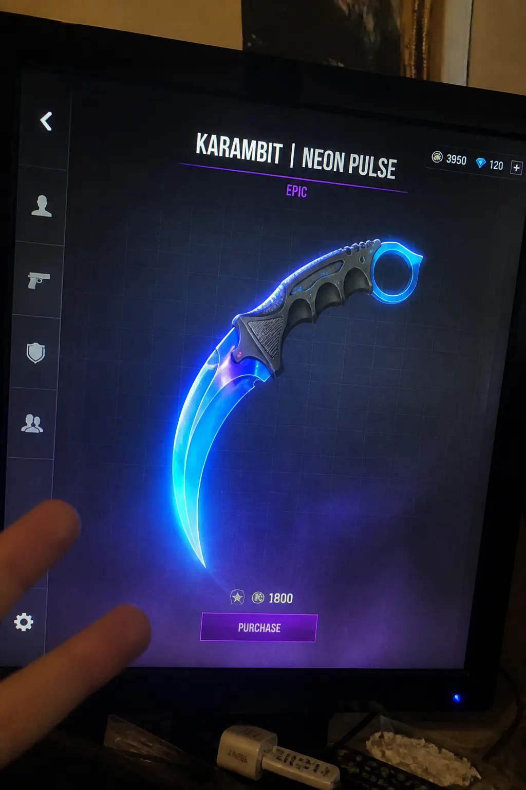 Physical GlowKatana LED karambit glowing in a dark room