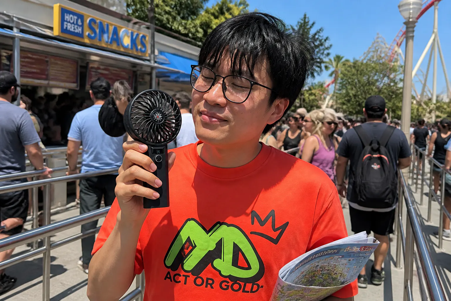 Person cooling off outdoors with the JetBreeze handheld fan