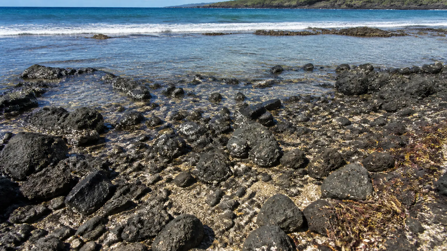 Rocky shoreline at the water's edge