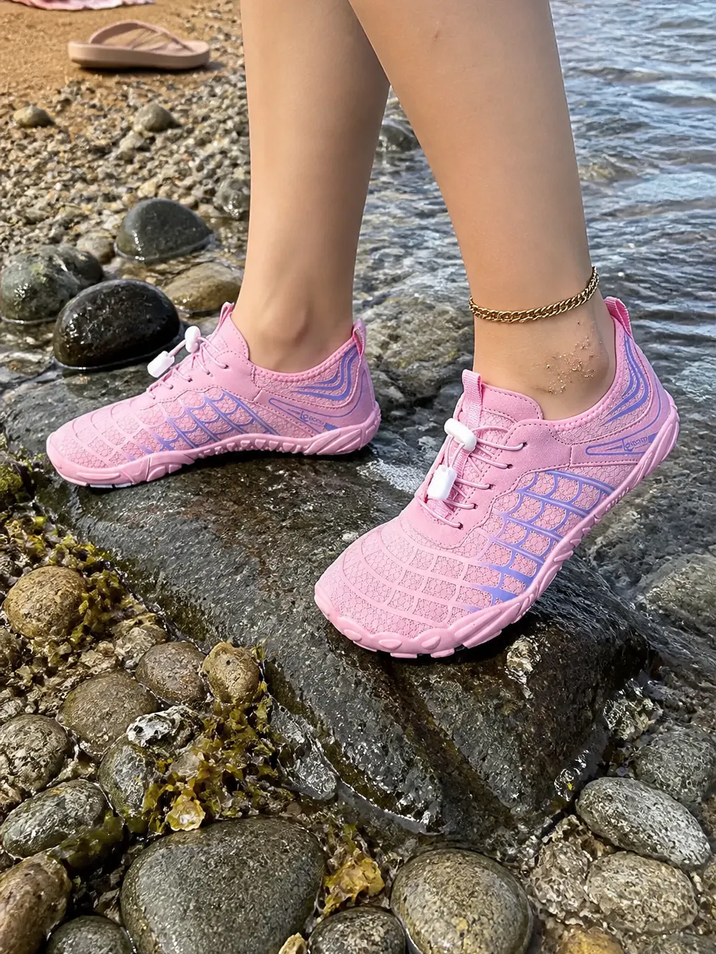 Ventra AquaFlex water shoes worn walking into shallow water over rock
