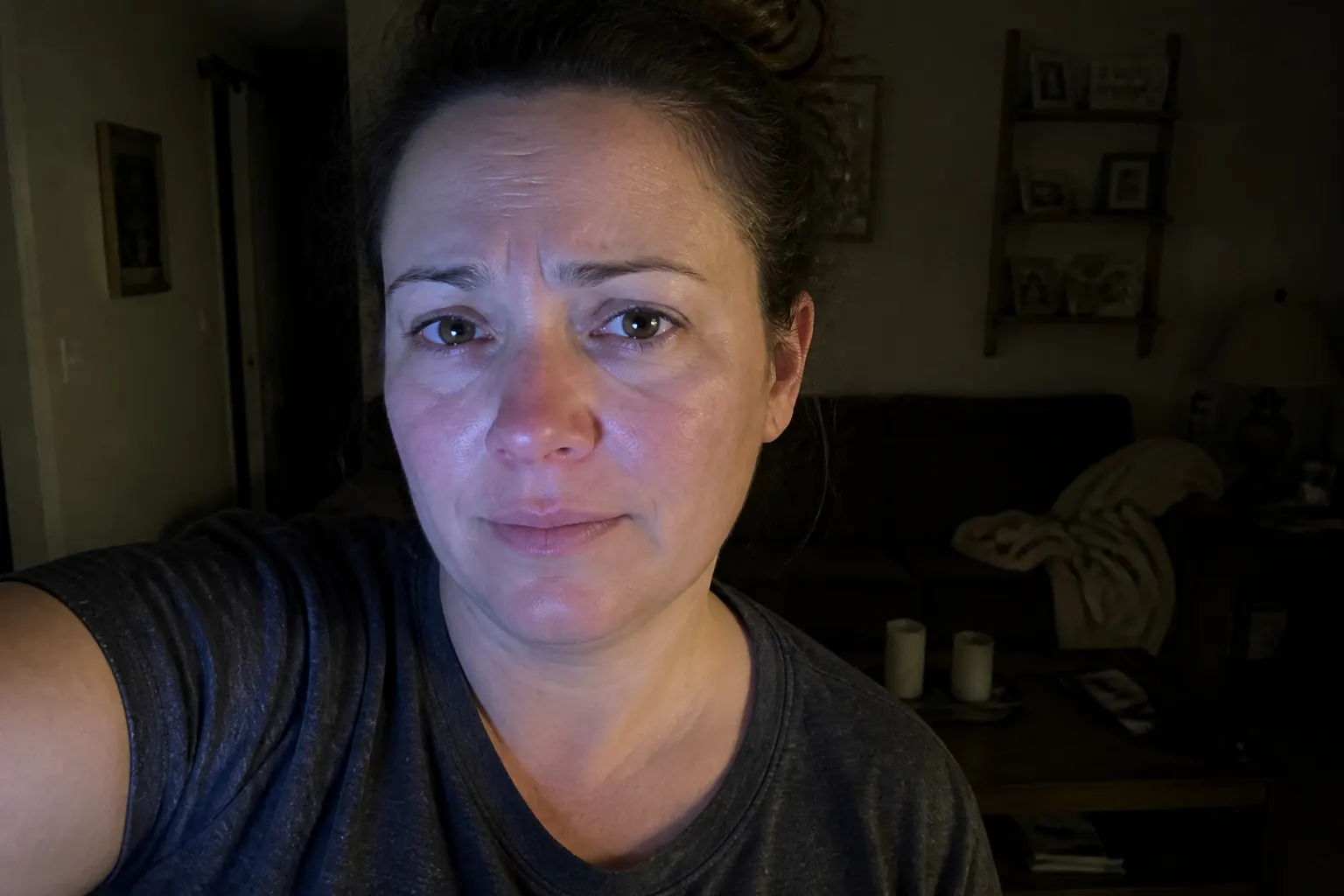 A dark room during a power outage with a dead phone