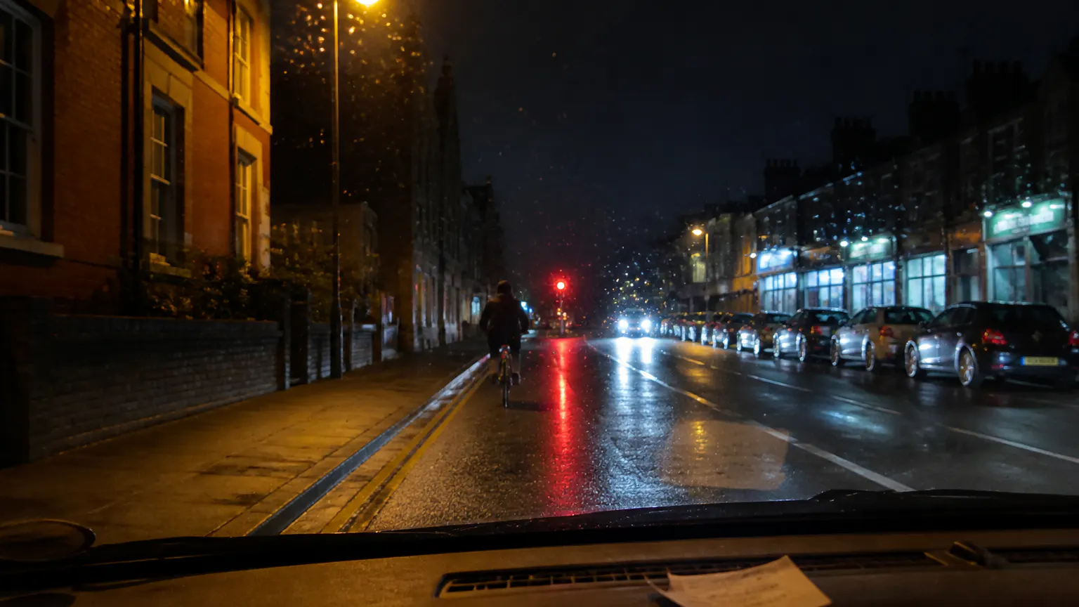 Driver's view of a cyclist with a low bar-mounted light at night