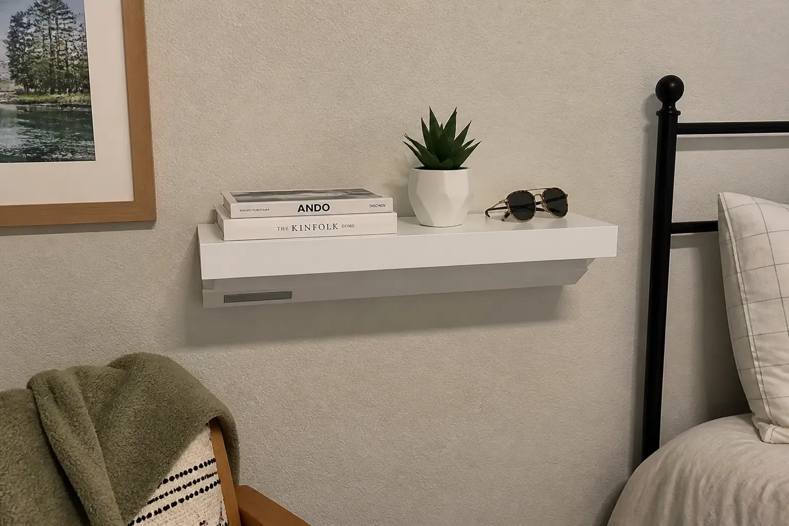 A clean floating shelf styled with décor, valuables invisibly stored inside
