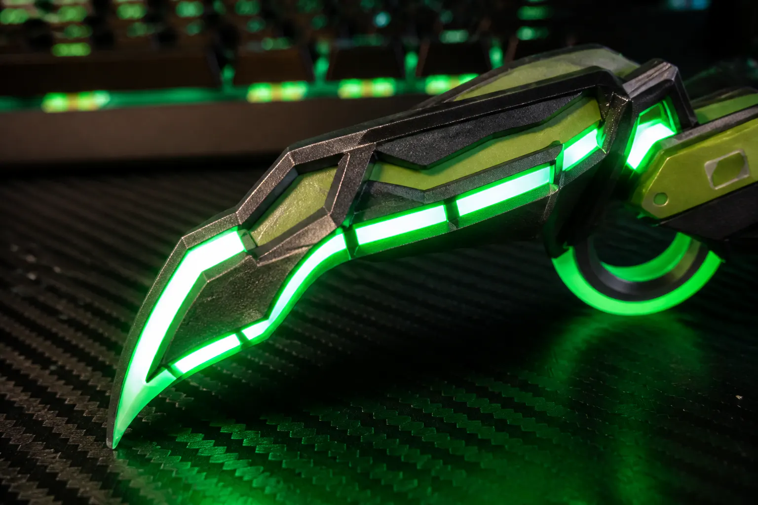 LED edge lighting glowing on the karambit blade