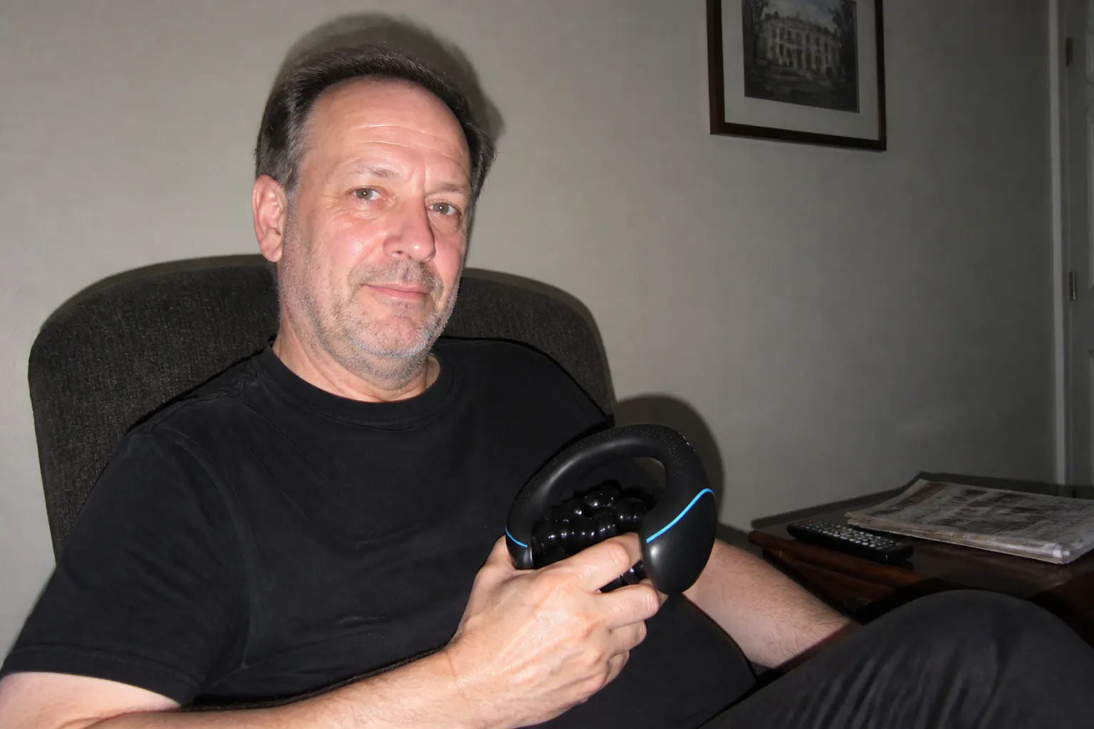 Customer holding the massager after a workout