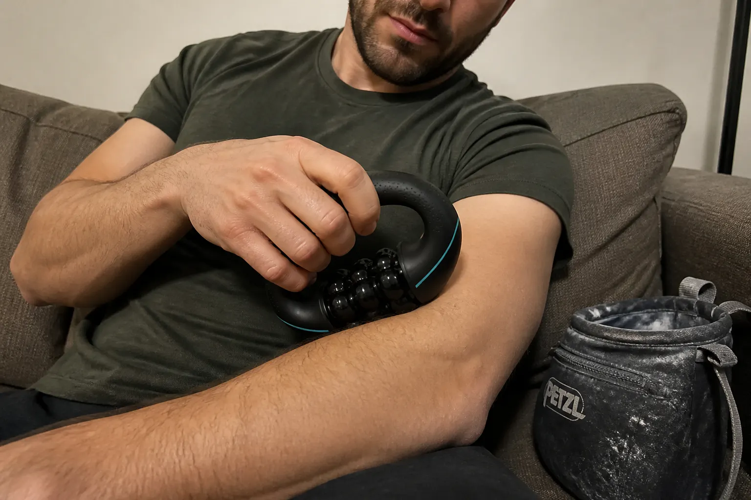 Customer rolling the massager on a forearm