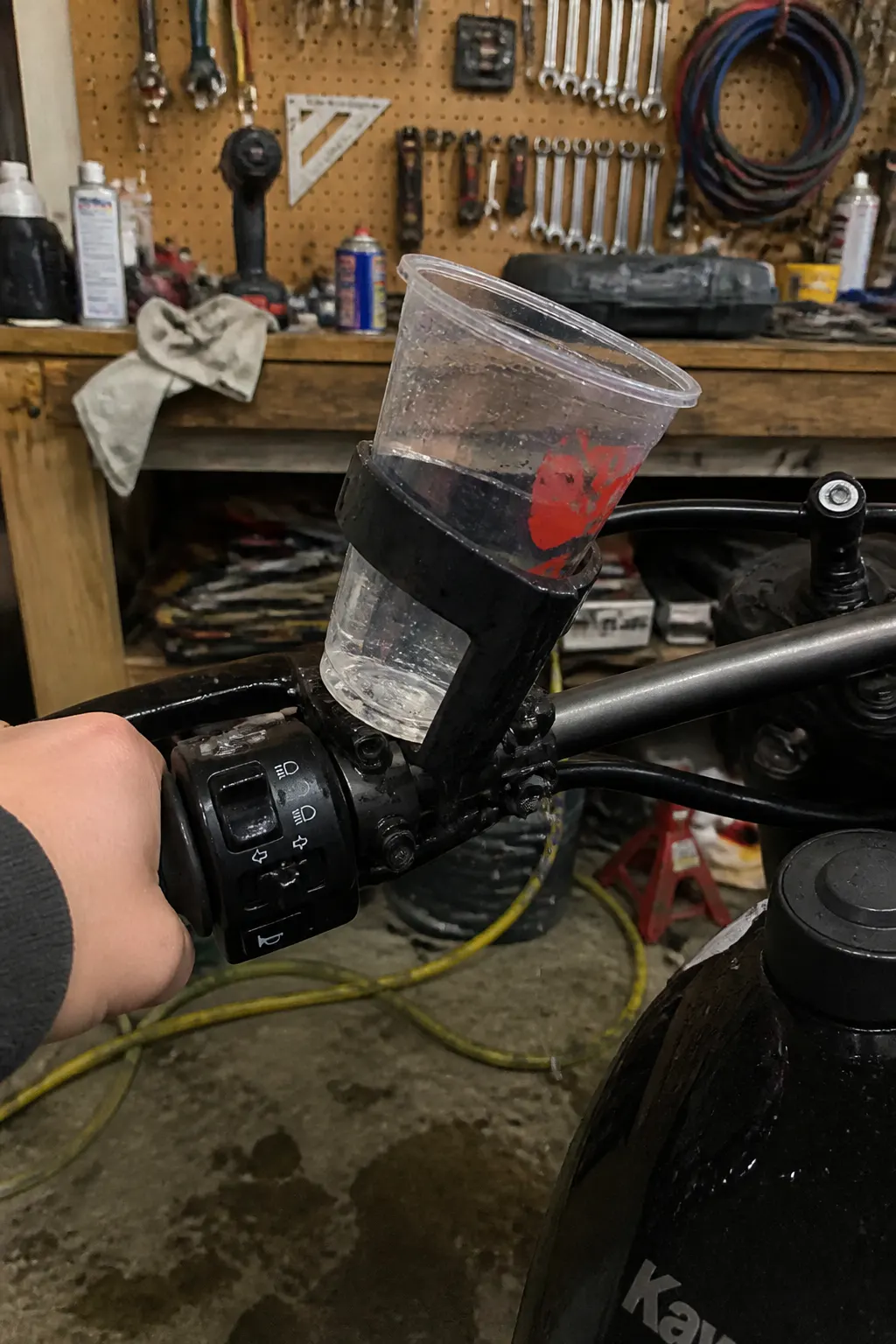 Cheap plastic cup holder wobbling with a tilting drink