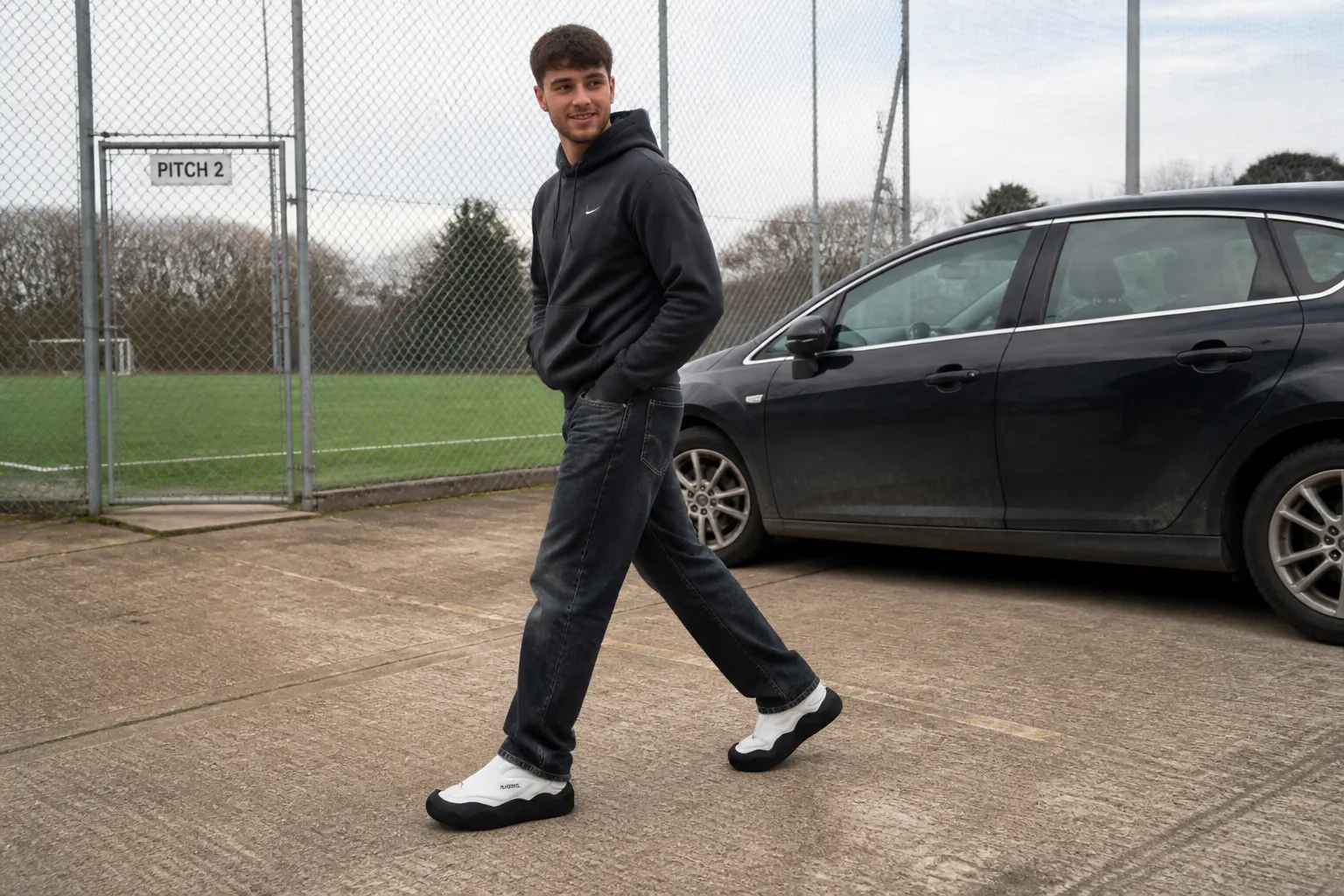 Walking on concrete in football boots with the moulded CleatShield tread gripping the ground