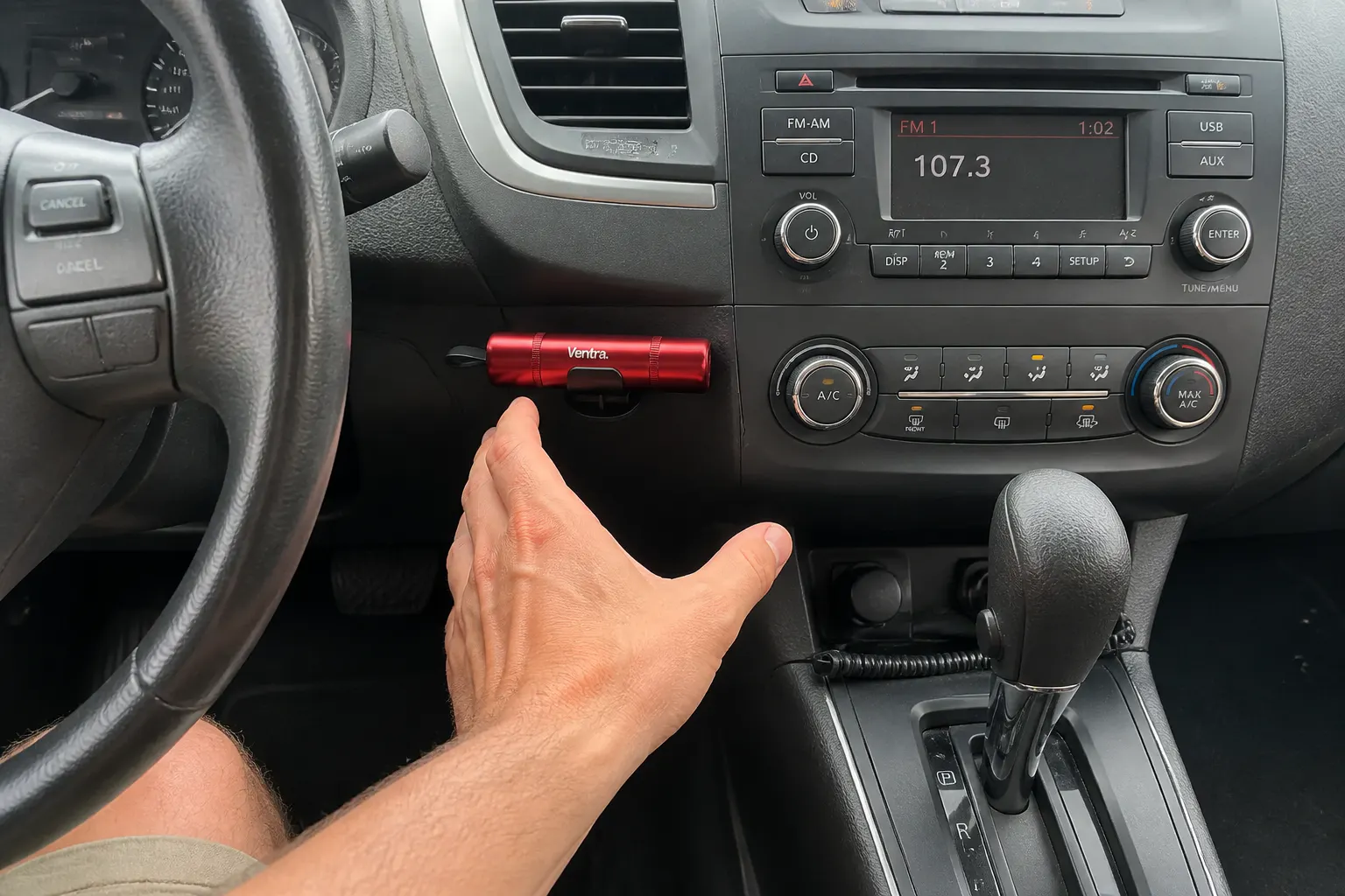The tool mounted on the console within reach of the driver's hand